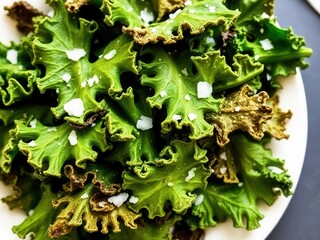 A plate of crispy kale chips seasoned with sea salt and a hint of garlic powder