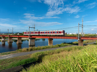 Wall Mural - 真夏の大和川を渡る近鉄道明寺線の電車