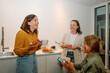© Franci Leoncio - Three businesswomen enjoying coffee and pastries during a break in the office kitchen
