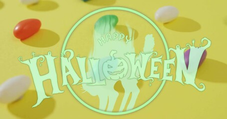 Canvas Print - Happy Halloween text animation over colorful candies on yellow background