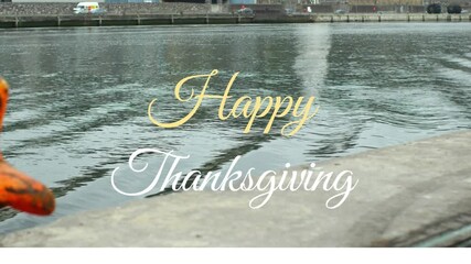 Poster - Thanksgiving text animation over calm waterfront scene with fall colors