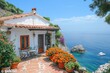 © kardaska - White mediterranean house overlooking the sea with orange flowers