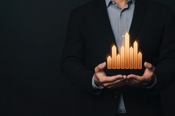 A business professional holds a stylish candle display showcasing growth, innovation, and modern design against a dark background.