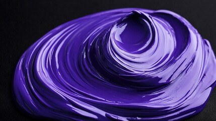   Close-up of purple paint swirl on dark surface Black background Foreground obscured by dark surface