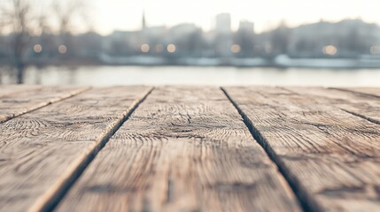 Wall Mural -   A close-up of a wooden table with a view of a body of water in the distance in the background, optimized text