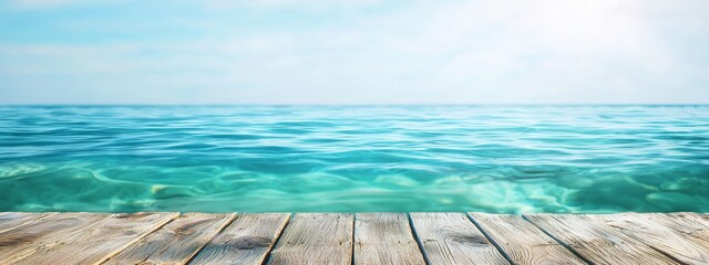 Wall Mural -  A scenic view of a tranquil body of water, featuring a weathered wooden pier in the foreground, and a vivid, clear blue sky overhead