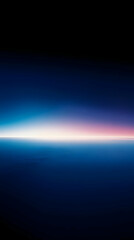 Wall Mural - A stunning view of the horizon with a pink and blue gradient sunset over the dark blue ocean.