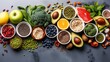 © angel_nt - A variety of colorful fruits, vegetables, nuts, and grains are beautifully arranged, showcasing their freshness and appealing textures on a dark gray surface
