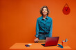 © Jacob Lund - Confident woman working in a home office with colorblocking elements