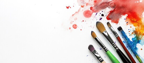 Poster - Drawing materials watercolor brushes and a palette on a white background. with copy space image. Place for adding text or design