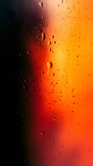 Wall Mural - Water droplets on glass with orange, red, and black background.