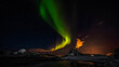 © RooM The Agency - Green Northern lights over coastal mountain landscape, Stor Sandnes, Flakstad, Lofoten, Lofoten and Vesteral Islands, Nordland, Norway