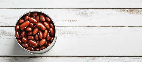 Aufkleber - Tin can containing kidney beans on a white wooden table with copyspace available