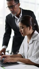 Wall Mural - Stressed businesswoman reacts to supervisor's criticism in office. Struggling, she buries her face in hands, showing signs of pressure and frustration.