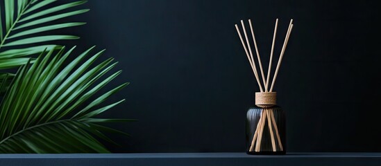 Aufkleber - Aroma reed diffuser home fragrance featuring rattan sticks against a black backdrop with palm leaves. with copy space image. Place for adding text or design
