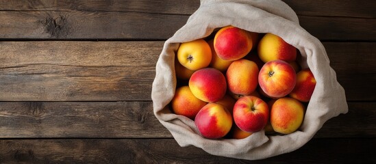 Fototapete - Eco friendly packaging zero waste for plastic shopping A lifestyle concept using recycled materials Fresh apples and peaches in a cloth bag Wooden boards backdrop copy space top view