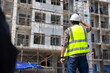 © NVB Stocker - back view Engineering people, construction site. construction worker planning and architecture in construction site. Caucasian men