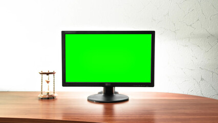 Computer green screen monitor is standing on a desk in an office timelapse hyperlapse.