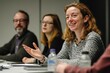 © khalid_spk - A team of professionals in a meeting room, engaged in a lively discussion. A woman is smiling