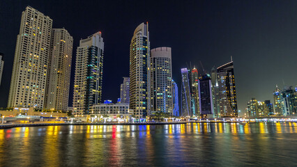 Dubai Marina towers and canal in Dubai night timelapse hyperlapse