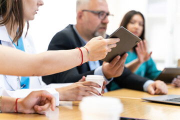 Group of Medical Team and Business People Meeting in Hospital and Office Conference Room