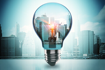 Poster - Glowing glass light bulb on blurry city background. Idea and innovation concept. 3D Rendering.