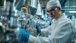 © liliyabatyrova - A woman in a white lab coat is wearing blue gloves