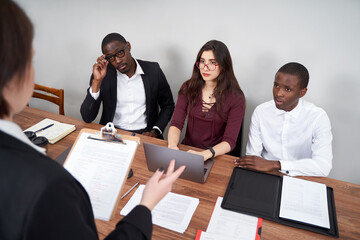 Wall Mural - Young happy business people working together in modern office, multiethnic teamwork