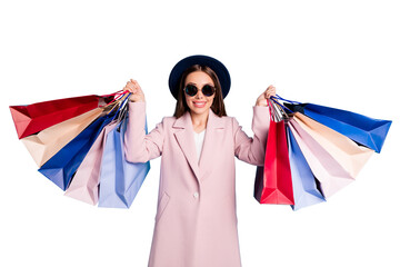 Canvas Print - 50% off! Portrait of cute sweet cheerful girl in eyewear eyeglasses go shopping buy present gifts on her vacation  wear pink season coat isolated on blue background