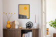 © FollowTheFlow - Elegant corner space featuring a bright yellow sunburst print, modern sculptures, and warm wood accents, offering a stylish contrast.