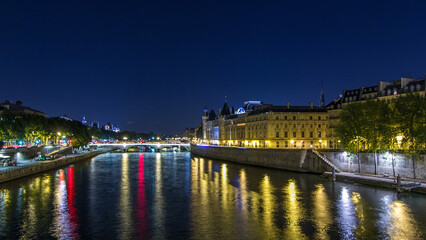 Wall Mural - Cite island view with Conciergerie Castle and Pont au Change, over the Seine river timelapse hyperlapse. France, Paris