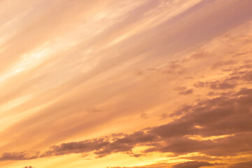 Wall Mural - Sky with soft and fluffy pastel orange pink and blue colored clouds. Sunset background. Nature. sunrise.