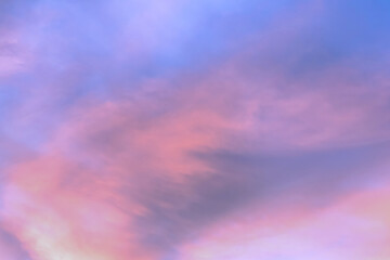 Wall Mural - Sky with soft and fluffy pastel orange pink and blue colored clouds. Sunset background. Nature. sunrise.