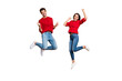 © deagreez - Full length photo of cheerful woman and man jump raise fists scream yes celebrate victory wear red sweater denim jeans isolated over yellow background