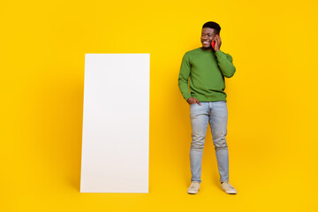 Wall Mural - Full body length photo of diversity male stand big smart phone telephone isolated yellow bright color background