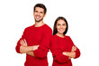 © deagreez - Portrait of cheerful couple with hands crossed wear red sweater isolated over yellow background