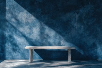 Wall Mural - Empty table on dark blue texture wall background. Composition with organic shadow on the wall and light reflections. Mock up for presentation, branding products, cosmetics food or jewelry , ai