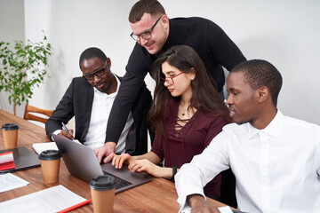 Wall Mural - Young happy business people working together in modern office, multiethnic teamwork concept