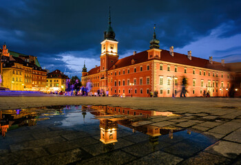 tourists on market square in historical part of warsaw, capital of poland in the nighttime