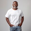 © zz - Portrait of a Smiling Middle-Aged Black Man Wearing a White T-Shirt and Jeans