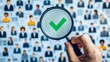 © kaiserseeing - Image of a magnifying glass highlighting a specific candidate from a large group, symbolizing the recruitment and hiring process.