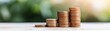 © auc - financial growth and prosperity stacked coins on wooden surface with green nature background for business, success, investment, and money saving concept.