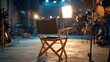 © Muhawaii - Empty director's chair on a film set with lighting and equipment.