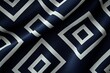 © grey - A minimalist black and white geometric pattern overlaid on a silky, deep midnight blue background
