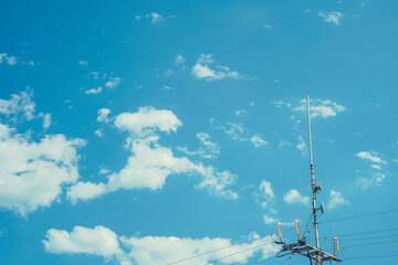 TV Antenna or TV Ariel against blue sky background with copy space on the left side.