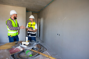 Wall Mural - engineer building inspection working at construction site. Architect and contractor working on building in construction site. Professional Architects Engineer