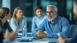 © Rajib - group of colleagues in business casual attire engaged in a lively discussion around a conference table