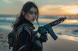 © Gary - A woman with a gun standing on a beach