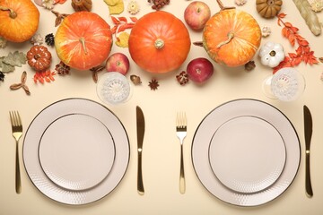 Sticker - Beautiful table setting with autumn decor on beige background, flat lay