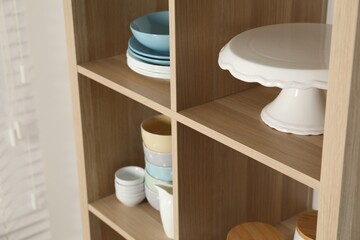 Wall Mural - Wooden shelving unit with kitchenware indoors, closeup